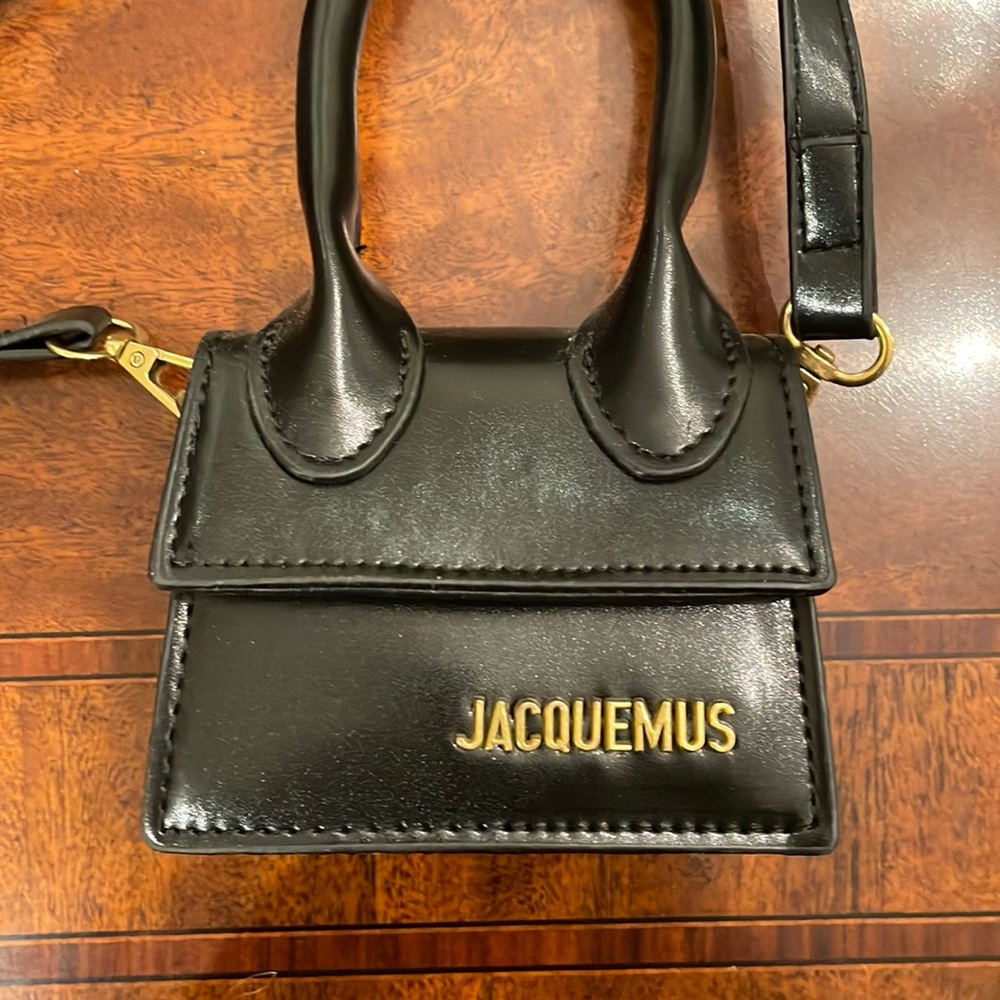 Micro Bag with JACQUEMUS in gold lettering.